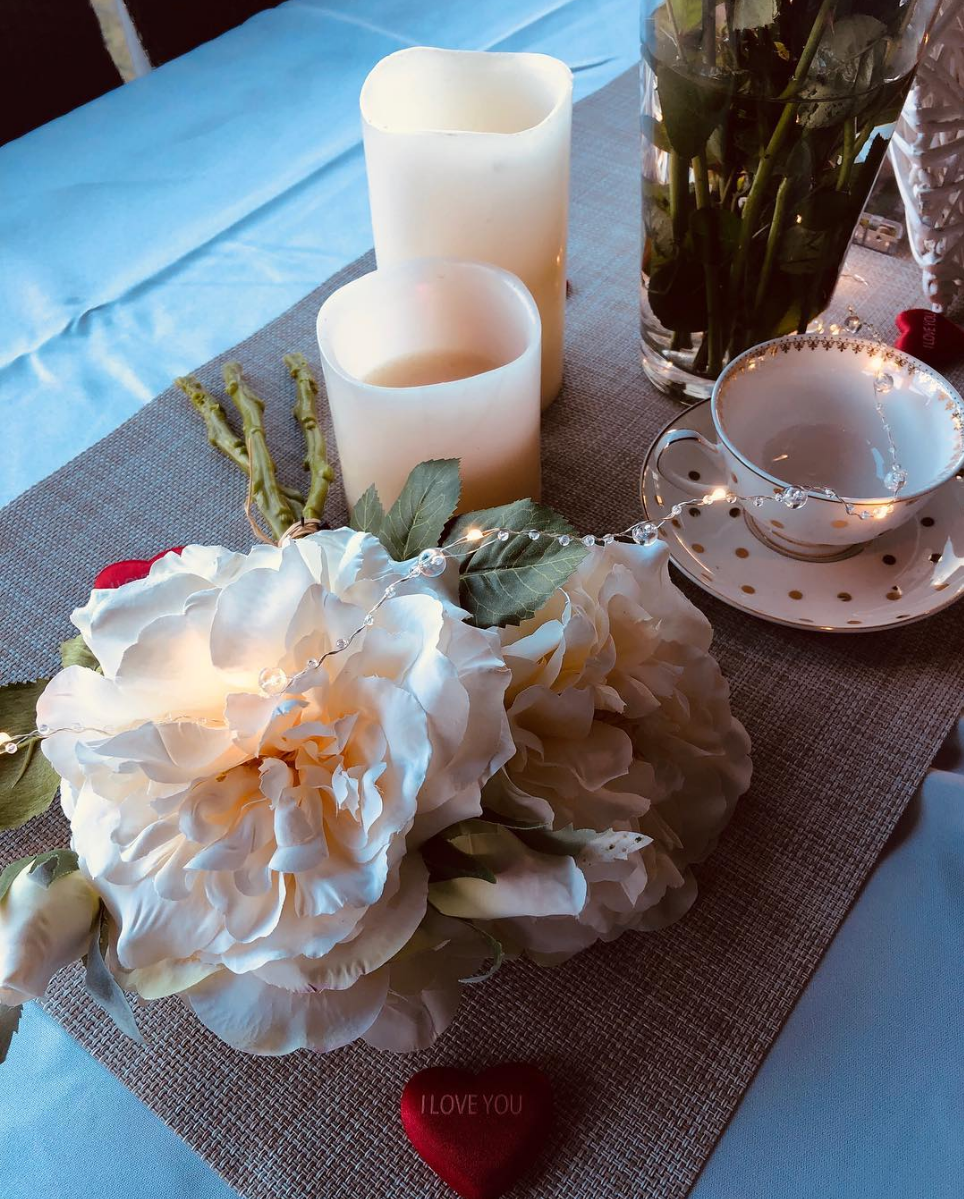 Elegant table styling with florals, candles and teacup detail